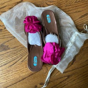 Brand New in dust bag Oka B bronze thongs with fuchsia flower embellishment .